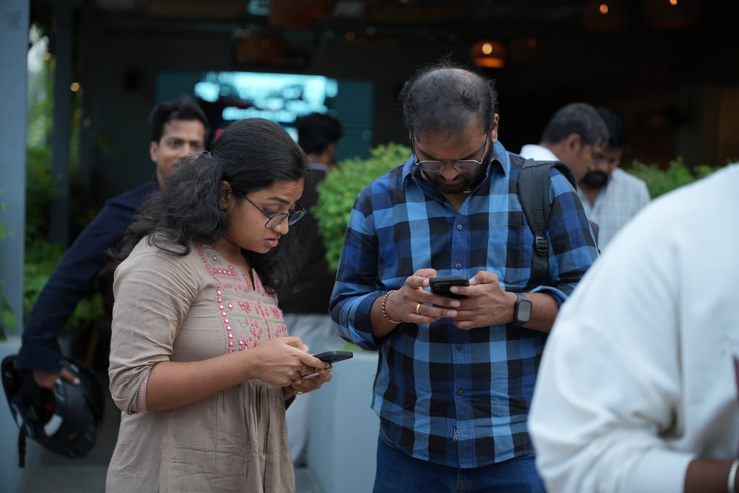 People checking in and talking at an event