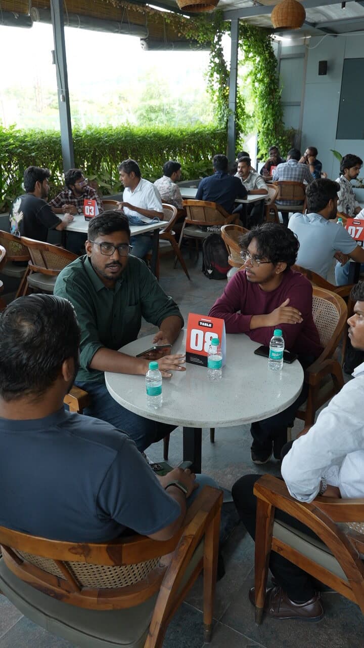 People having conversations around a table
