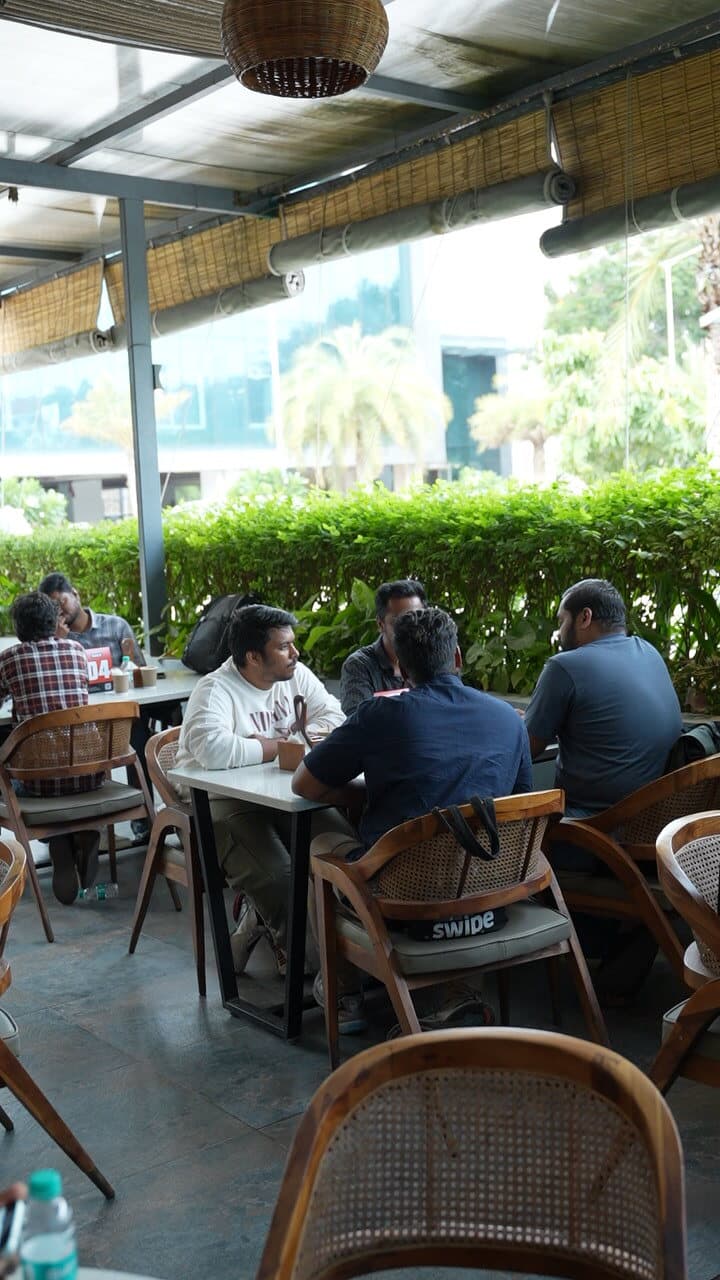 People seated at a cafe table